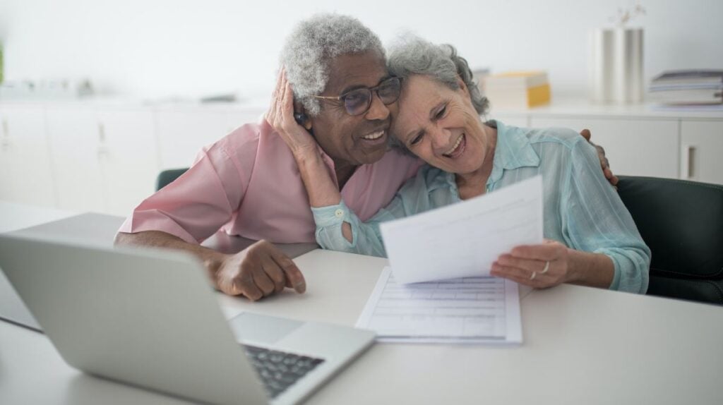 older couple looking at a bill