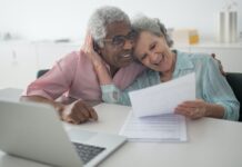 Does Insurance Cover Digital Health Apps and Devices? older couple looking at a bill